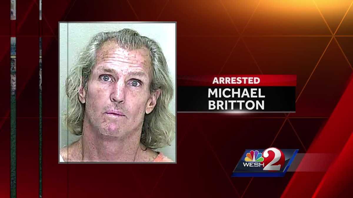 Man arrested, accused of throwing dog into traffic