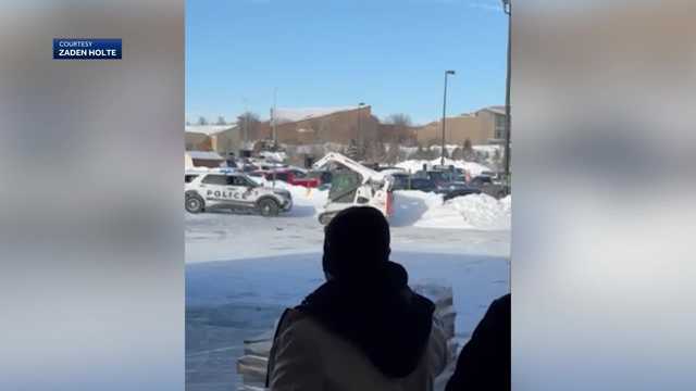 WATCH: A man in a skid loader rams police cruiser - Vimarsana News