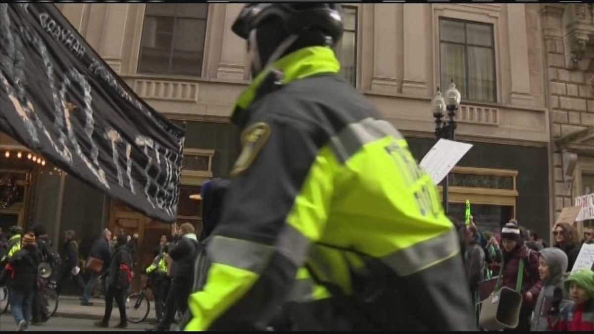 Protesters arrested as thousands march through Boston