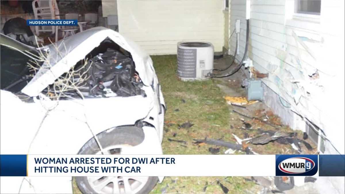 woman drives car into house