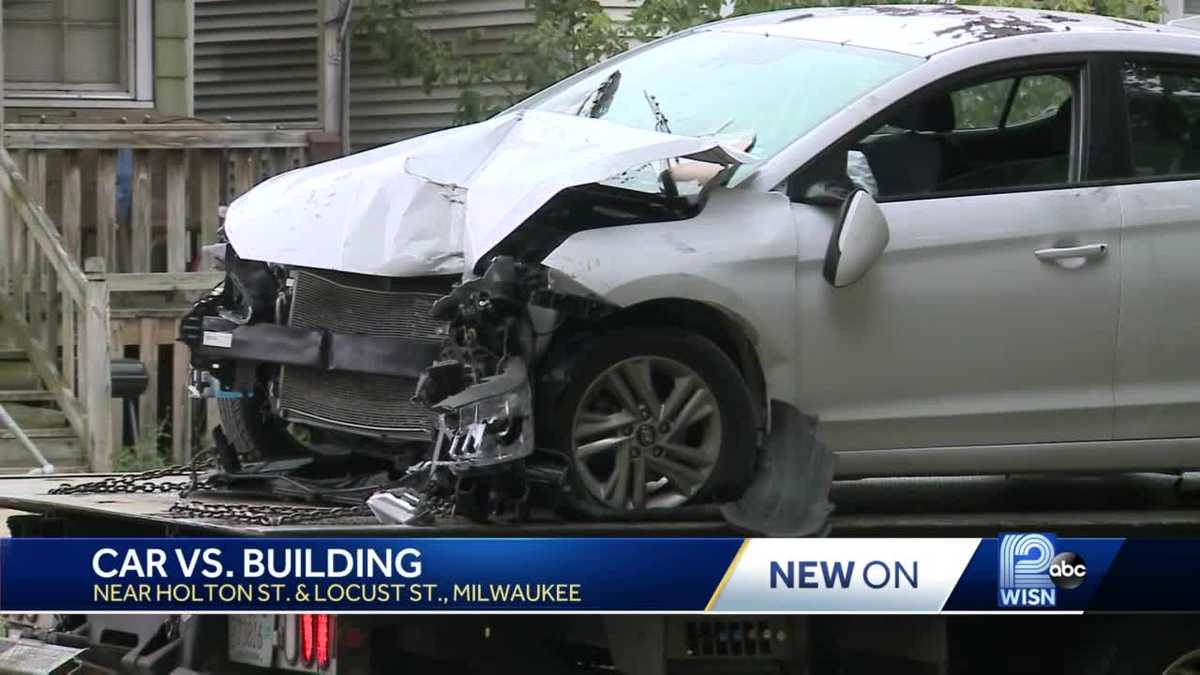 Car slams into building