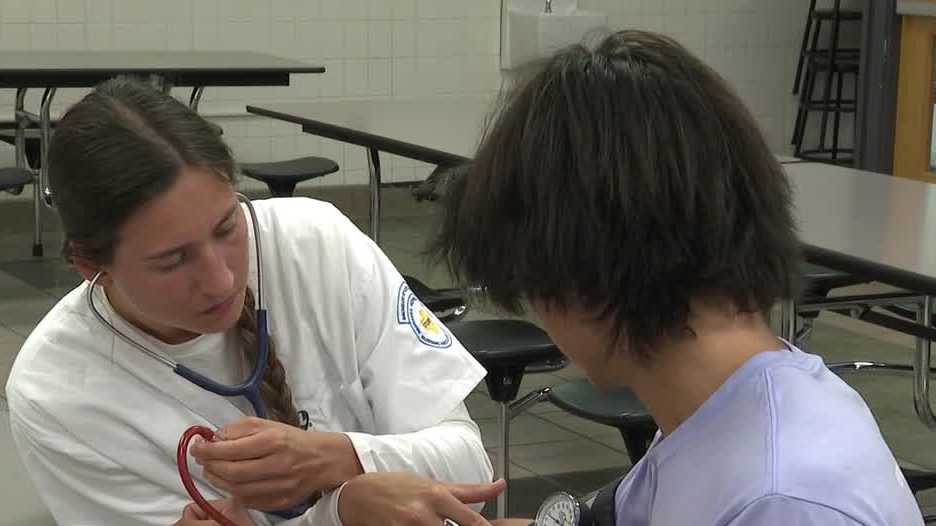 Nebraska Methodist College students give free sports physicals to Burke High athletes