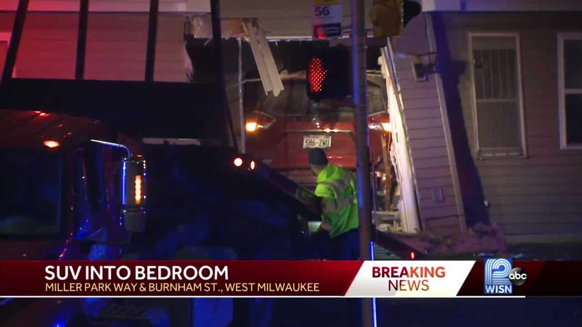 SUV crashes through apartment, narrowly misses sleeping woman