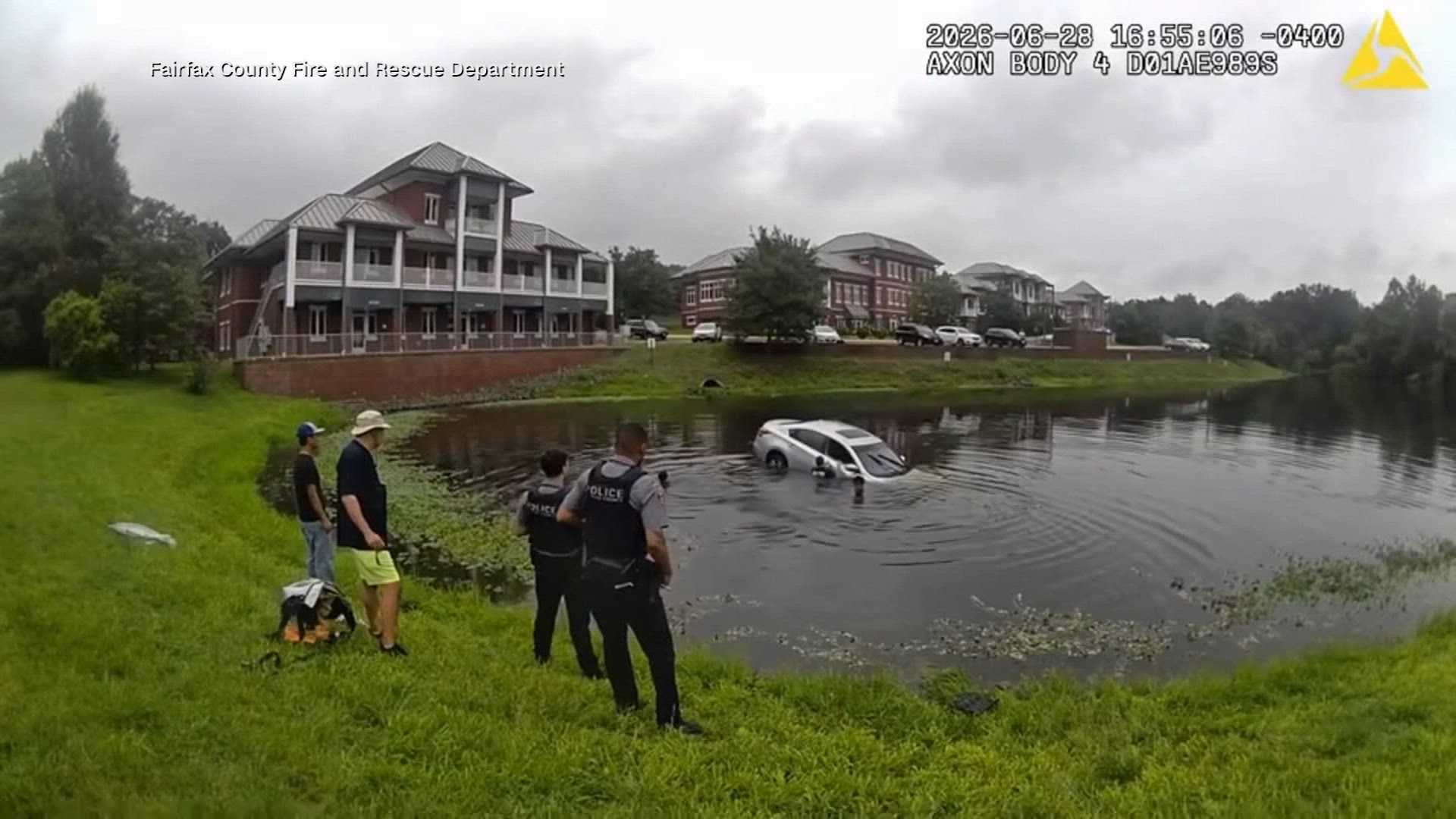 Body cam video shows first responders forming human chain to save driver from sinking car