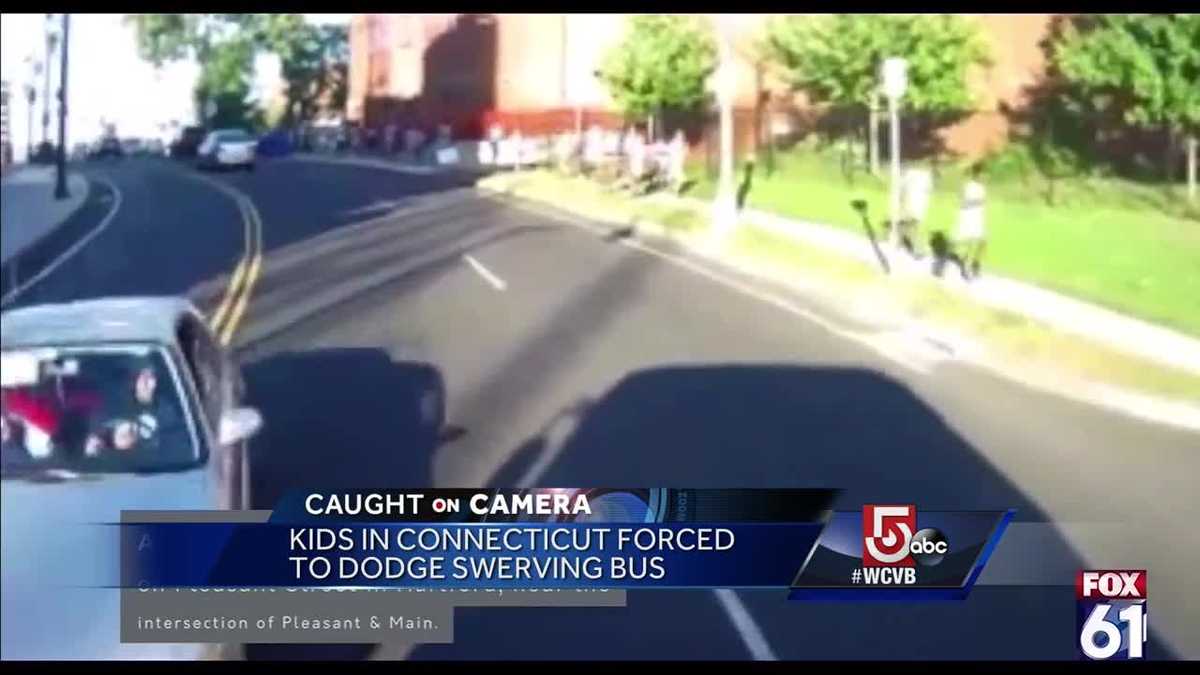 Bus driver narrowly misses hitting kids after car strikes bus