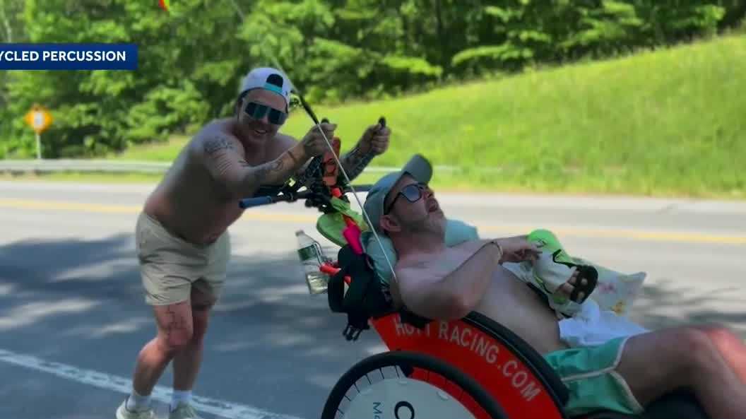 Justin Spencer of Recycled Percussion continues cross-state journey with wheelchair-bound friend