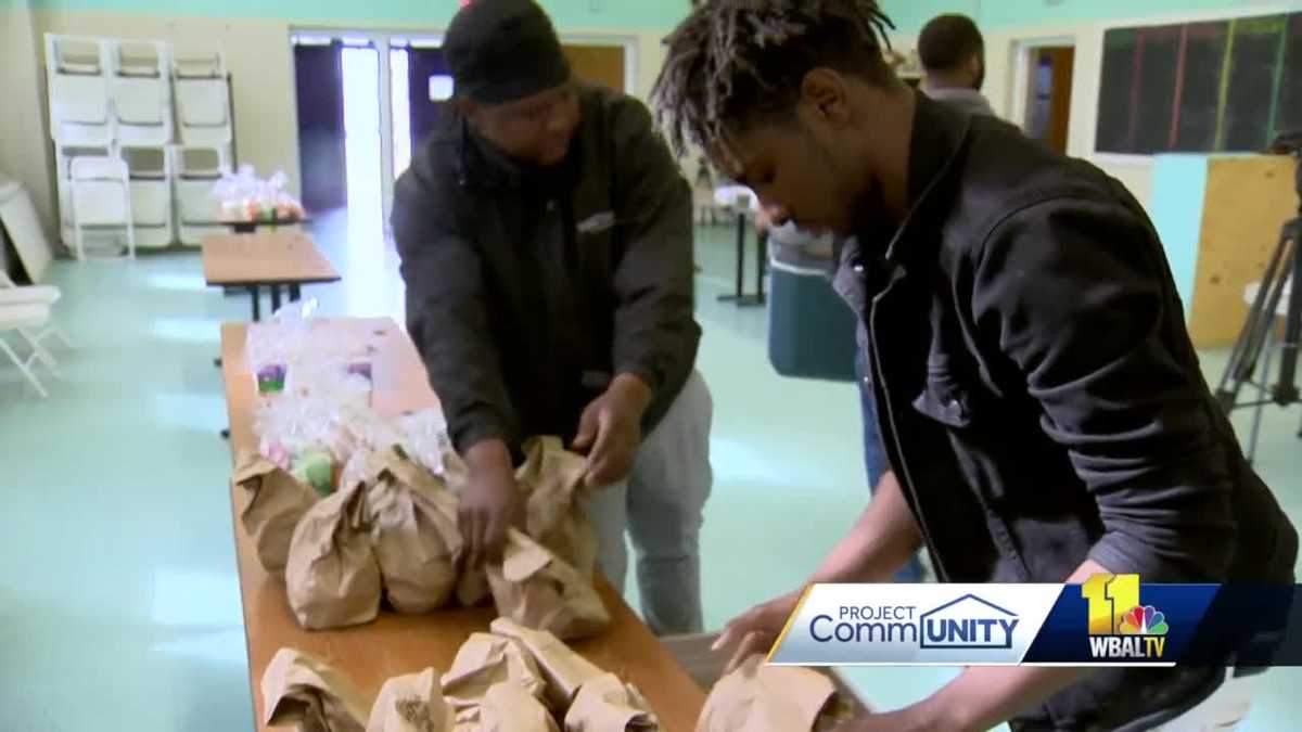 Amid coronavirus pandemic, squeegee workers hired to help distribute food in Baltimore