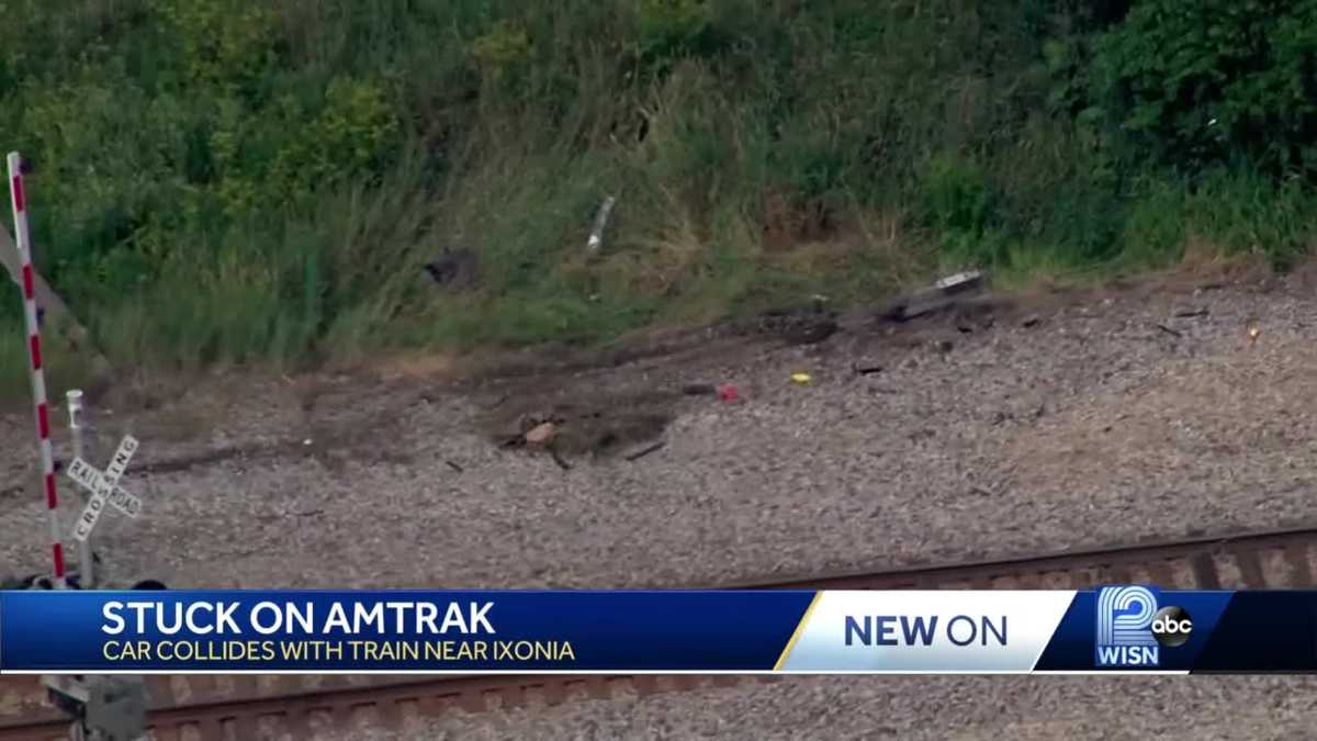Car crashes into Amtrak, passengers stuck for three and a half hours