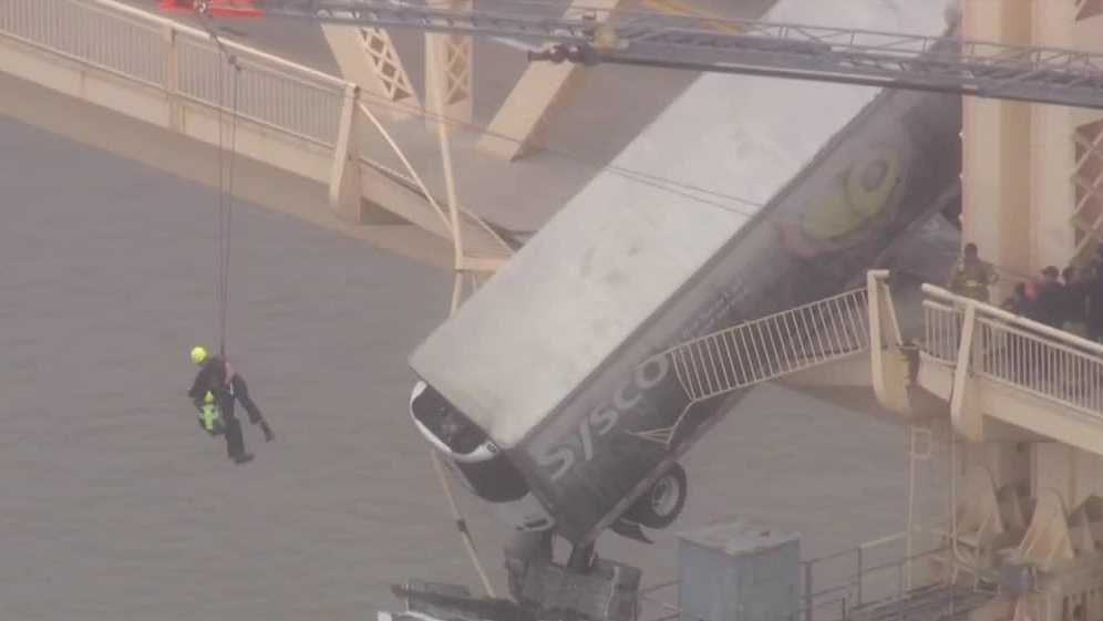 Louisville firefighter recounts dramatic rescue from semi truck hanging over Ohio River