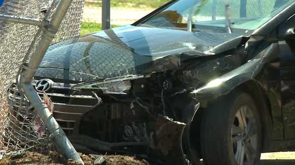 stolen vehicle driven by juveniles crashes into school baseball field fence