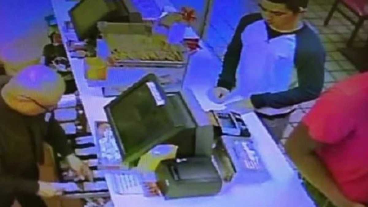 Police release photos of suspect wanted in connection to robbery
