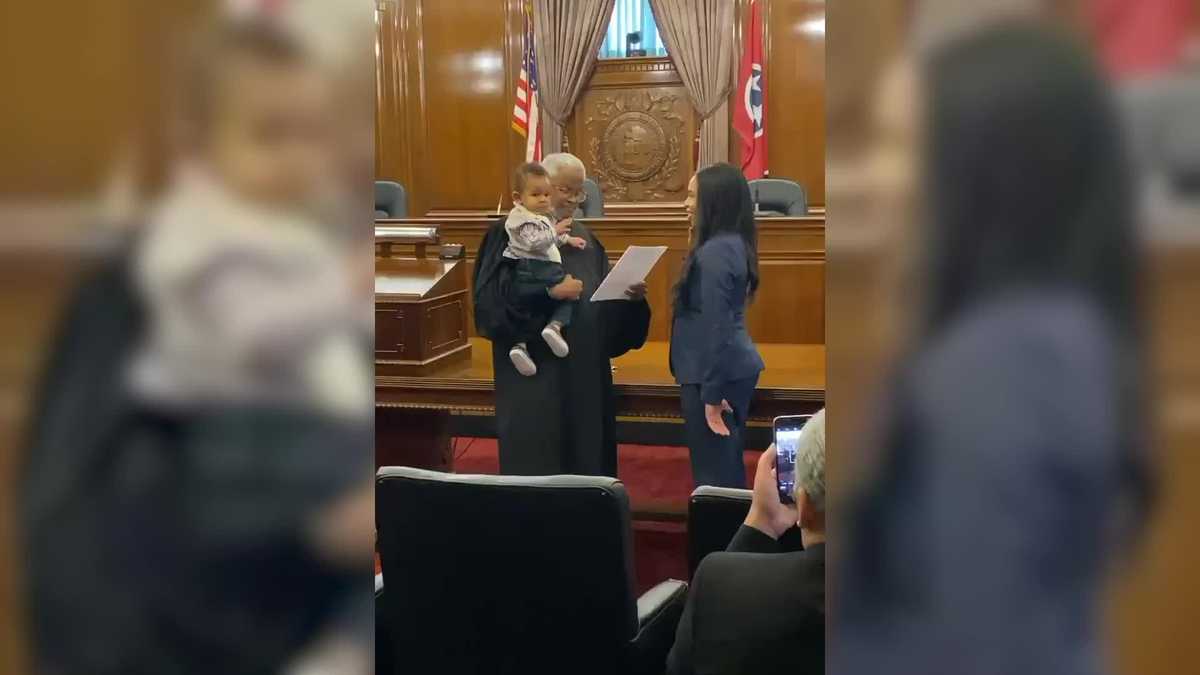 WATCH: Judge holds 1-year-old child of woman being sworn in as lawyer
