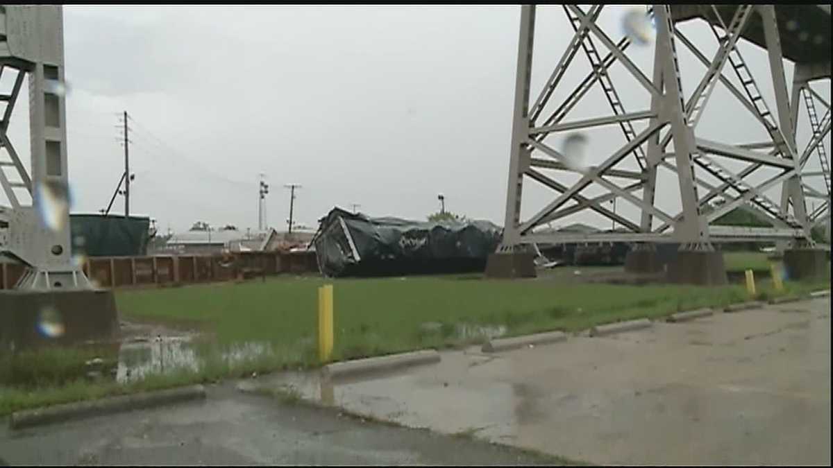 Rail cars, shipping containers fall from Huey P. Long Bridge during