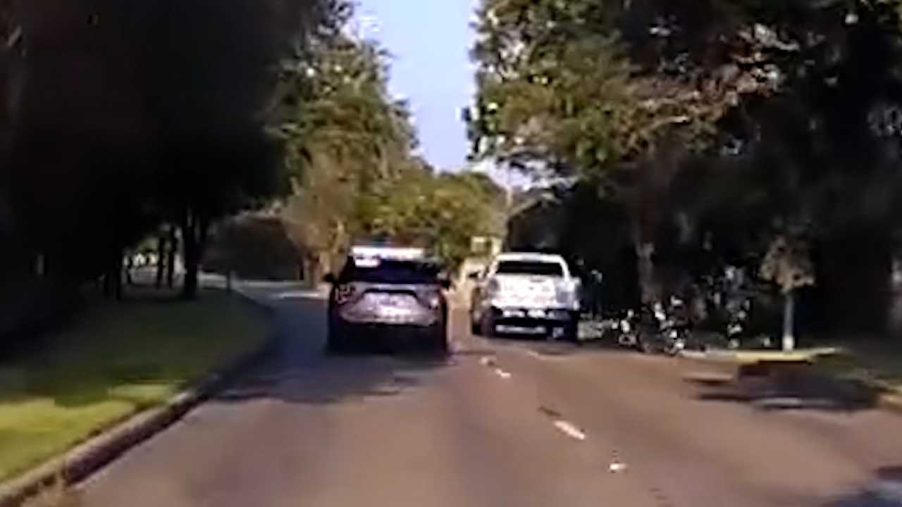 ATM theft suspect caught on video throws cash out the window during police chase