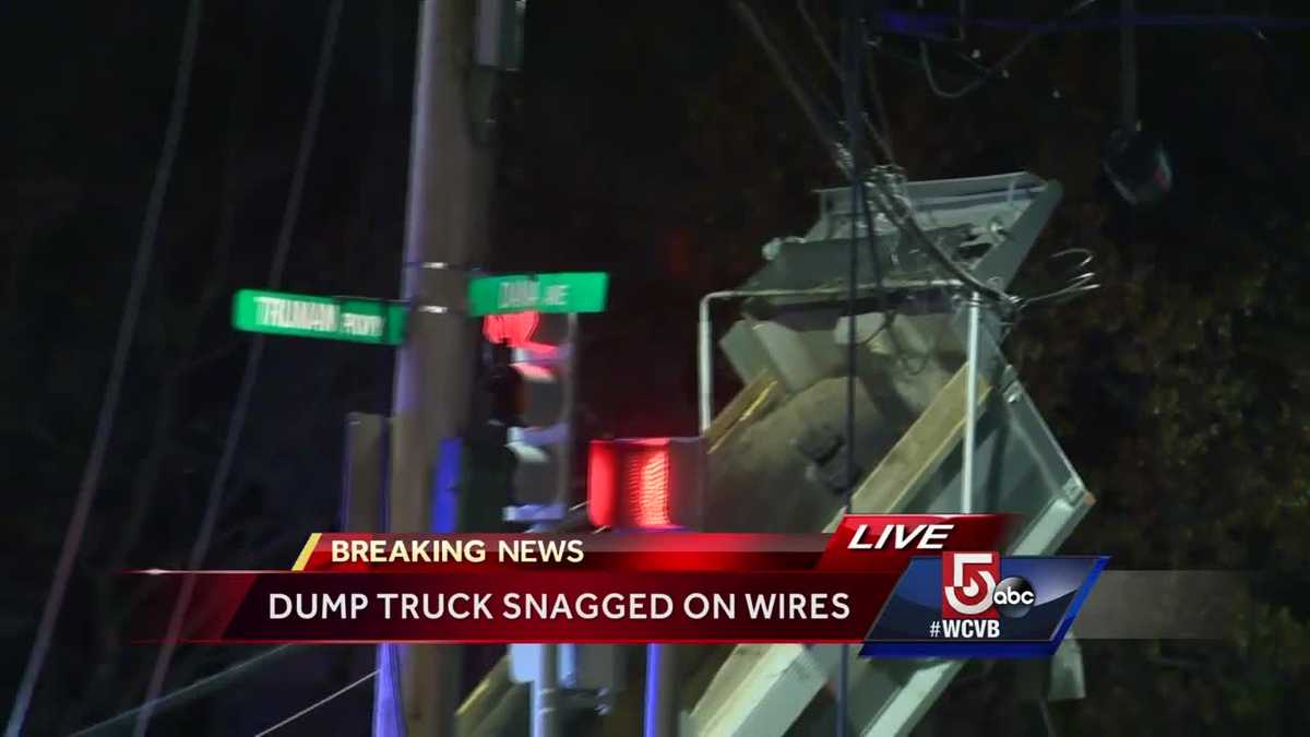 Dump truck brings down power lines