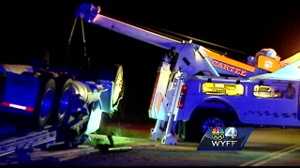 Truck driver recovering after his semi flips on a highway, trapping him ...