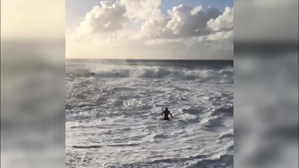 Video Pro Surfer Rescues A Woman Struggling In Rough Water On Hawaiis North Shore 8602