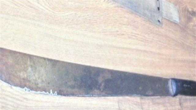 Man accused of threatening neighbor with machete