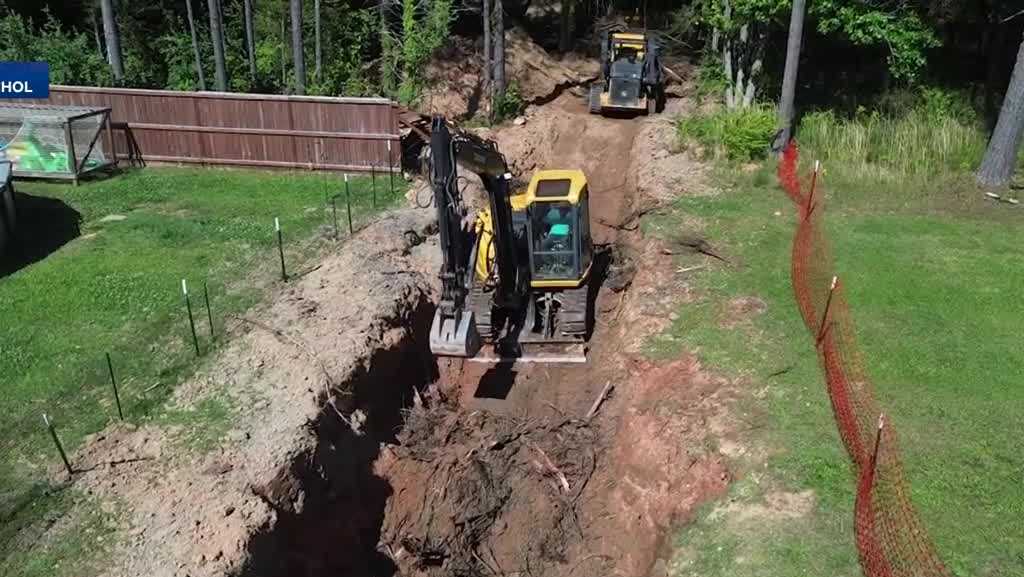 Buried trees under home causing holes, headaches for neighbor