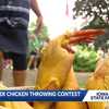 Women show off their strength in rubber chicken throwing contest at Pioneer Hall