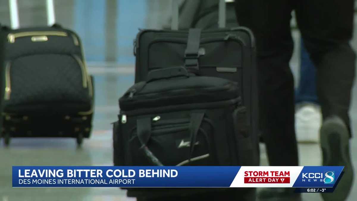 Iowans fly out of Des Moines for (slightly) warmer temperatures