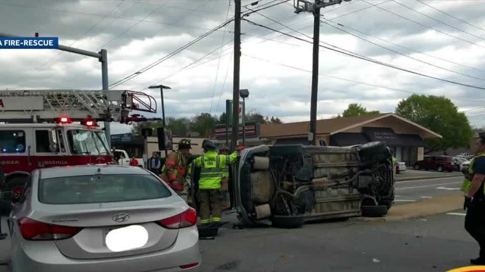 Car ends up on its side after crash in Nashua