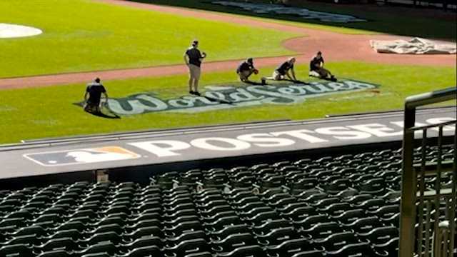 Brewers grounds crew paints 'World Series' onto grass at American Family Field
