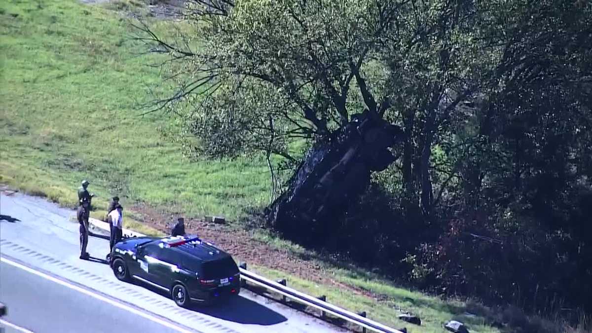 Person flown to hospital, vehicle stuck in tree after crash off southbound I-35 near Guthrie