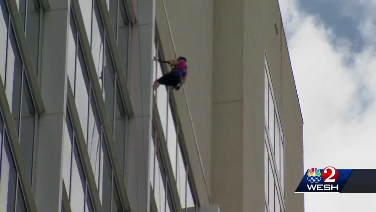 More than 100 rappel from Orlando hotel to raise money for critically ...