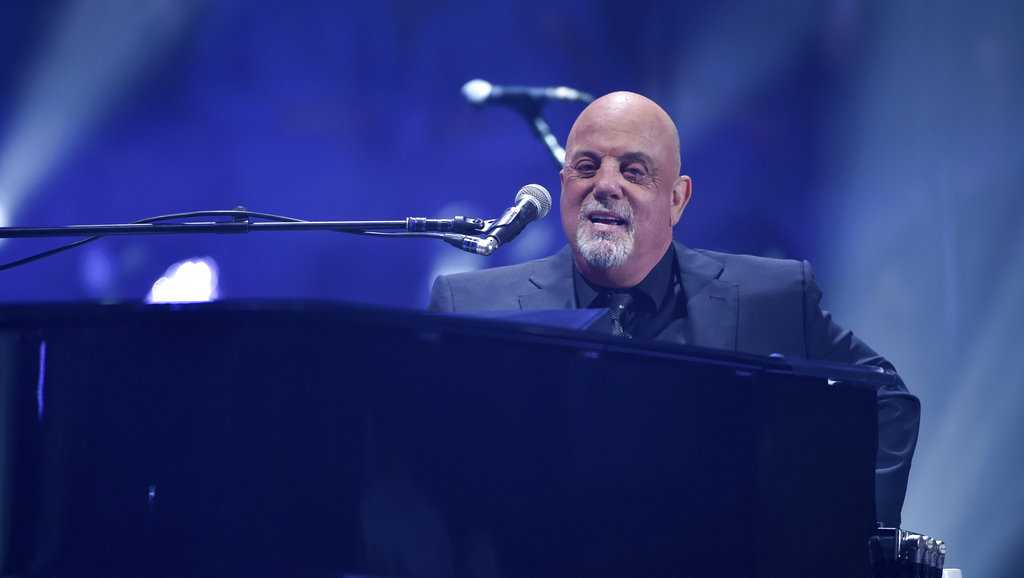 Billy Joel playing in the rain in Fenway Park