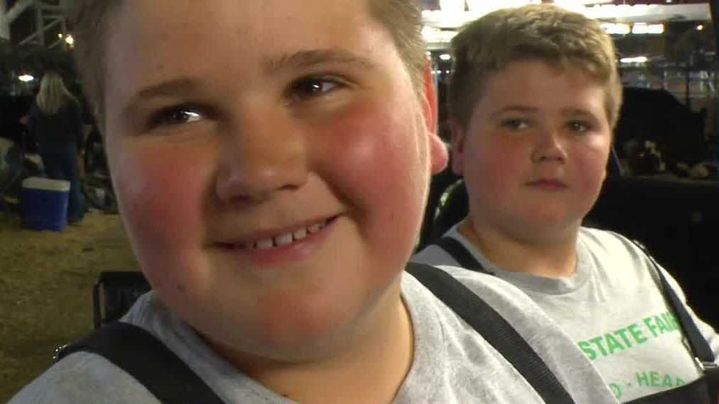 Twin brothers show steers at the Iowa State Fair ahead of their birthday