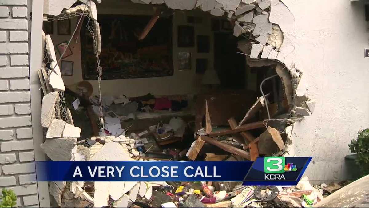 Man lucky to be alive after car smashes into home