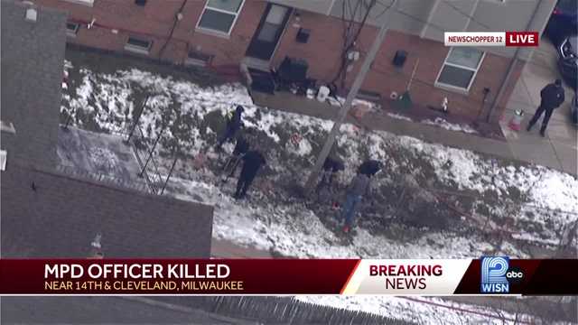 Investigators search scene where Milwaukee officer was shot