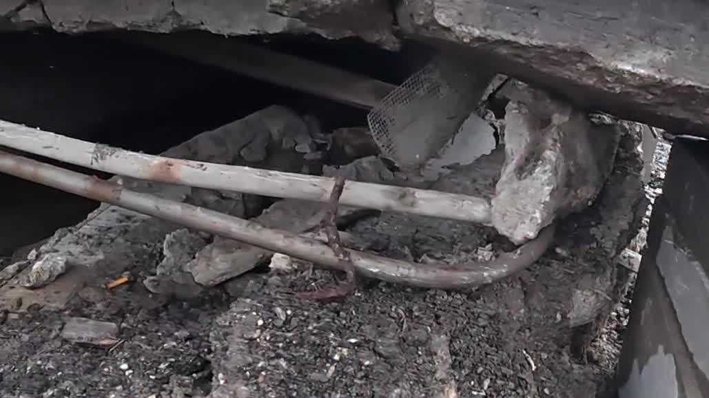 Platte County store owner discovers storm drain erosion under historic building porch