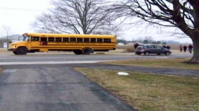 Third grade student struck by car while headed to school bus