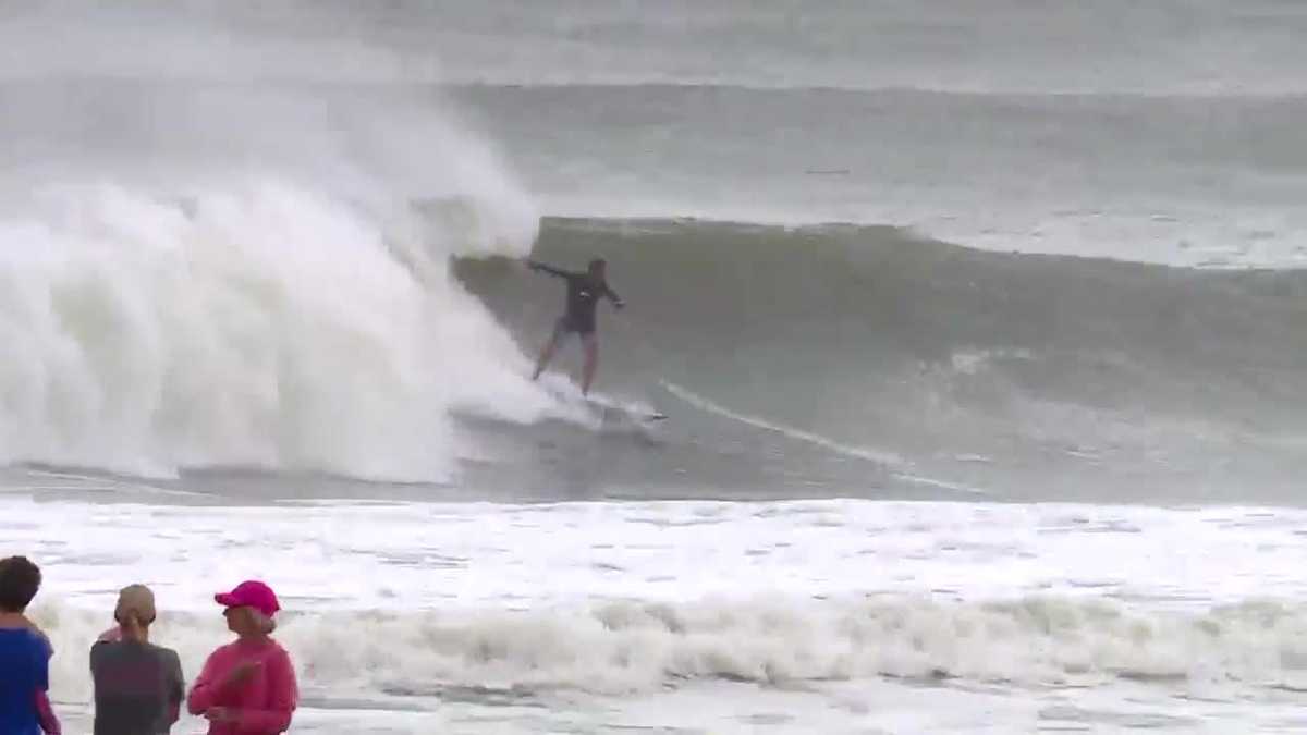 Surfers ride huge waves in Orange Beach, Alabama