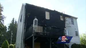 Officer kicks in door to rescue woman, child from burning home