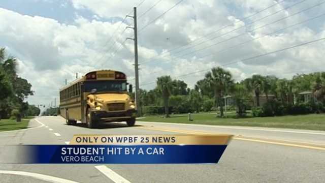 Student crossing street to bus stop struck by oncoming car