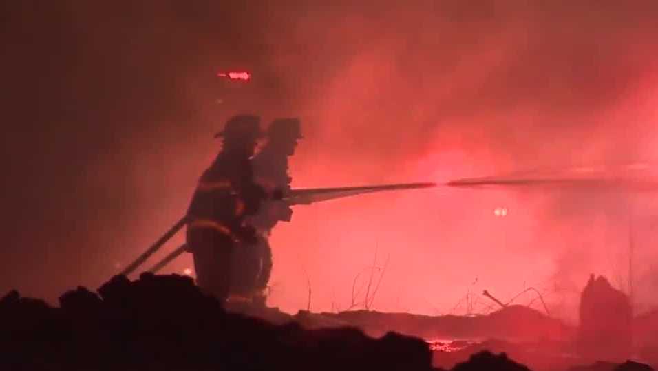 Crews battle massive warehouse fire
