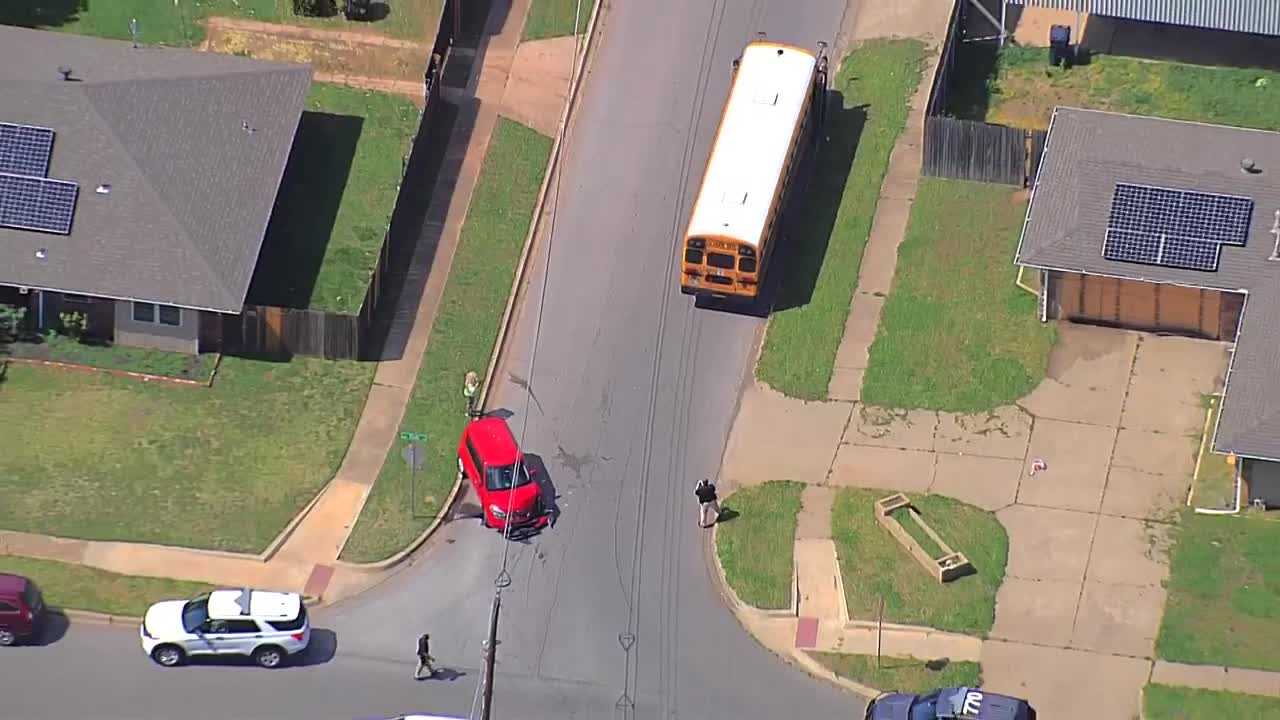 Car significantly damaged after crash involving school bus in southwest OKC