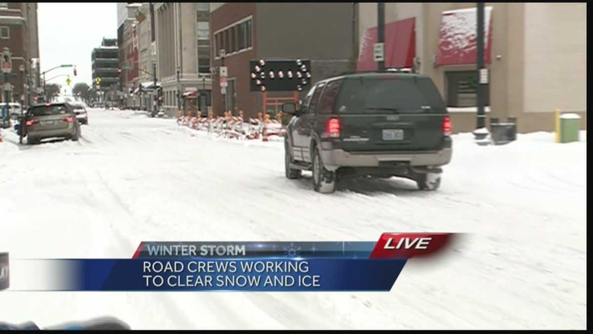 Road crews work to clear snow, ice