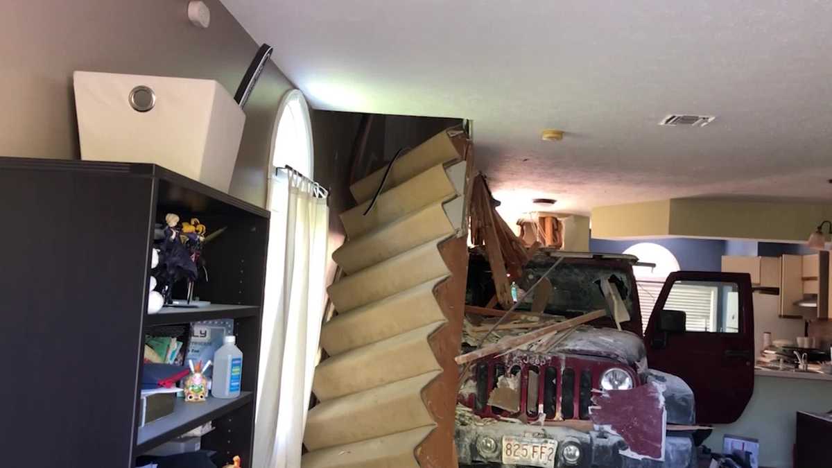 Uncut Jeep crashes through Danvers home