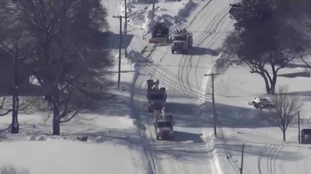 New Hampshire crews help restore power in Southern New England after historic storm