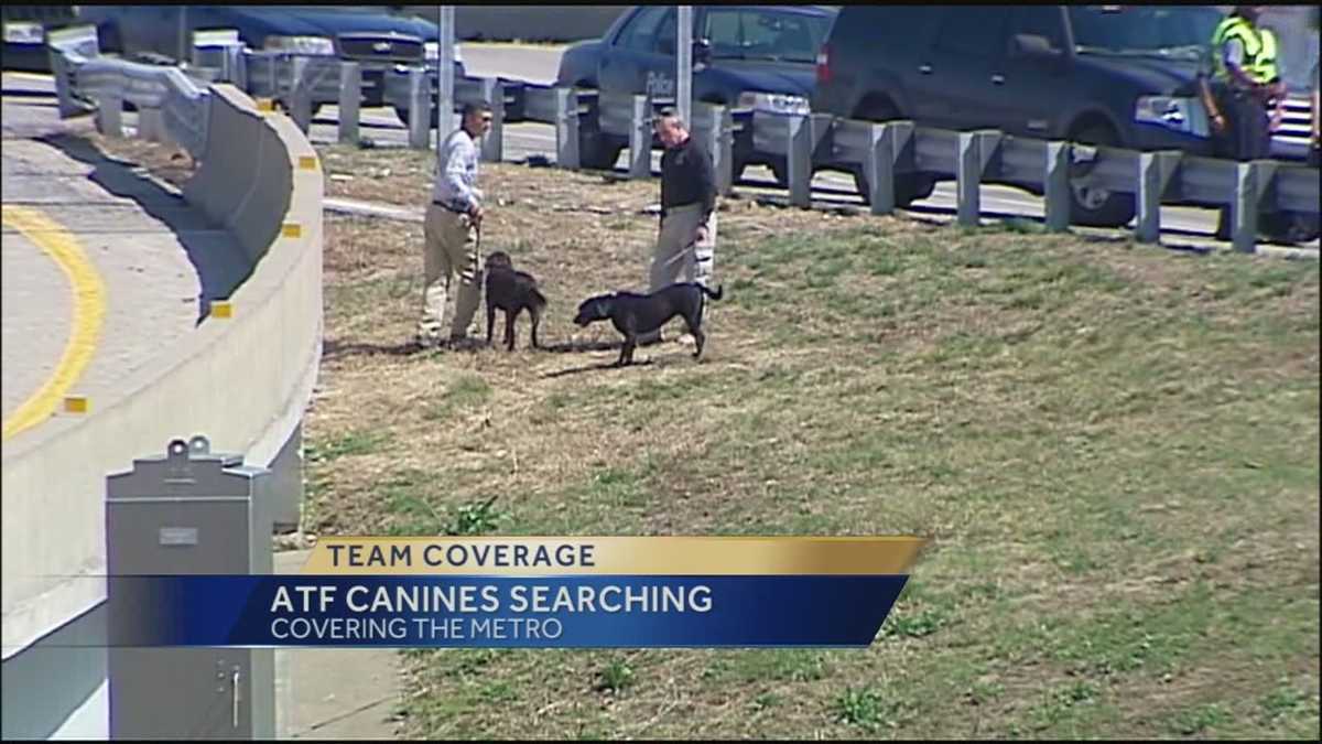 Trained dogs help ATF agents look for evidence in highway shootings