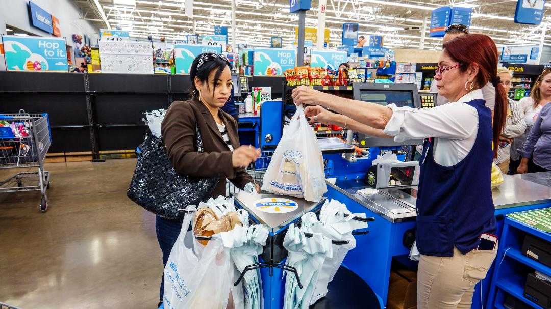 walmart-set-to-pay-65-million-over-making-cashiers-stand