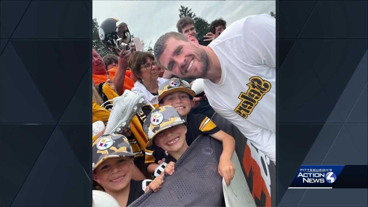 Check out Steelers LB T.J. Watt as he signs a baby at training camp