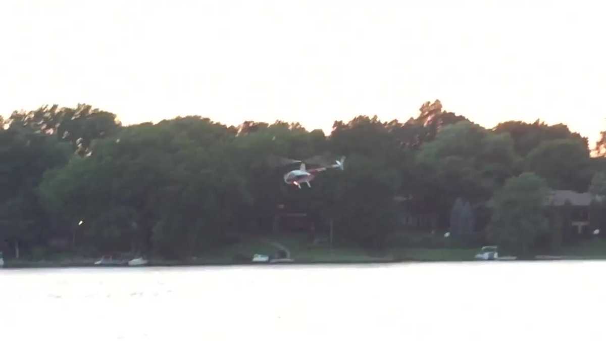 Watch Helicopter's low flight over Weatherby Lake draws spectators