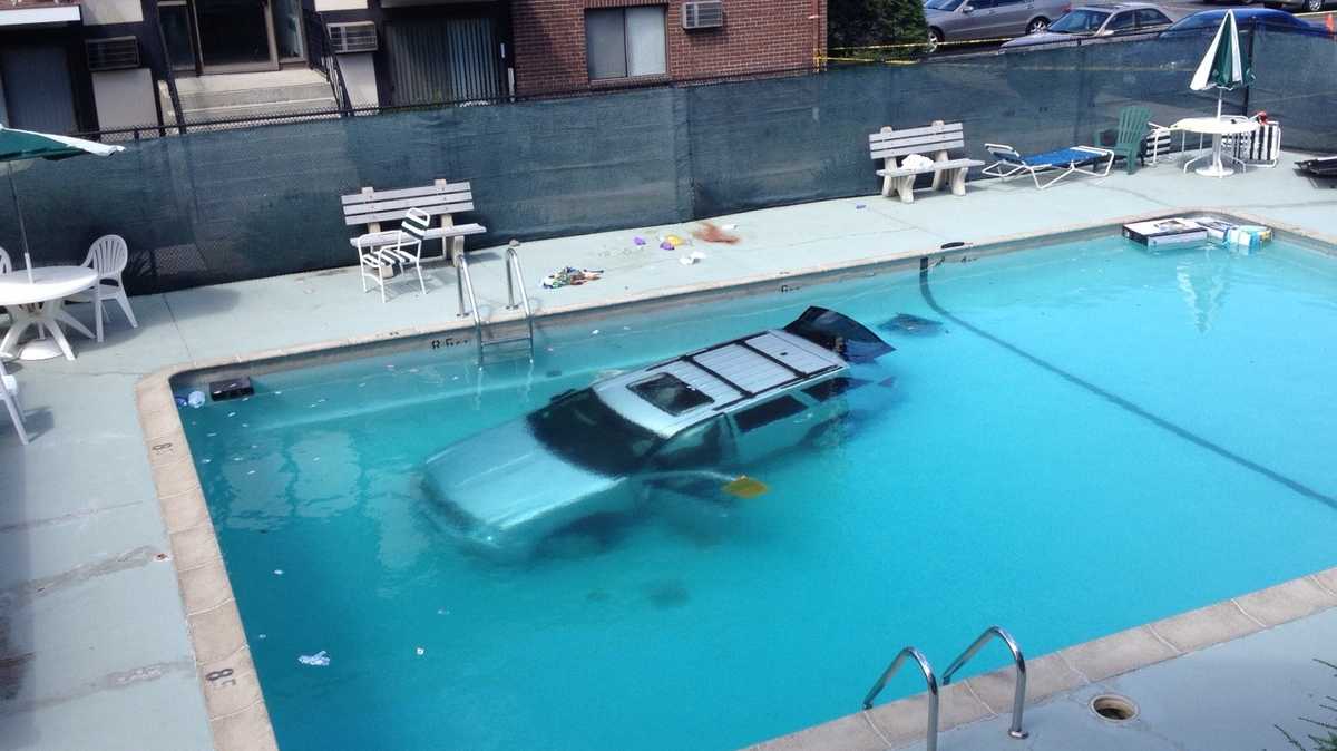 Woman killed after crashing SUV into condo complex pool