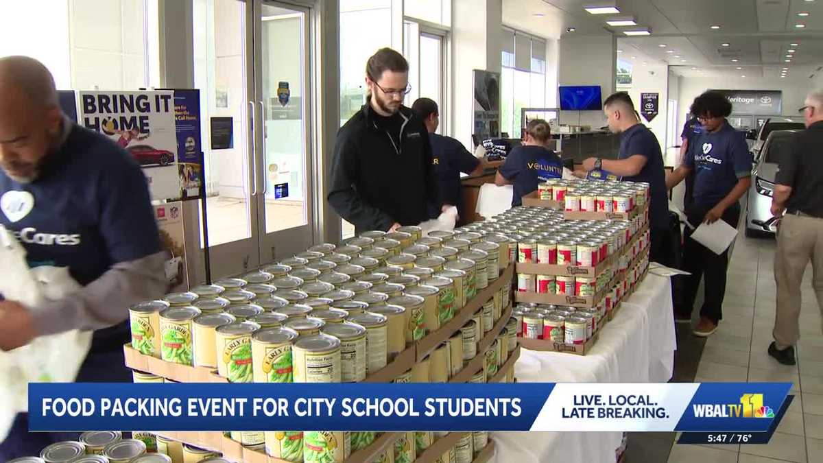Baltimore volunteers pack 8,000 bags of food for students