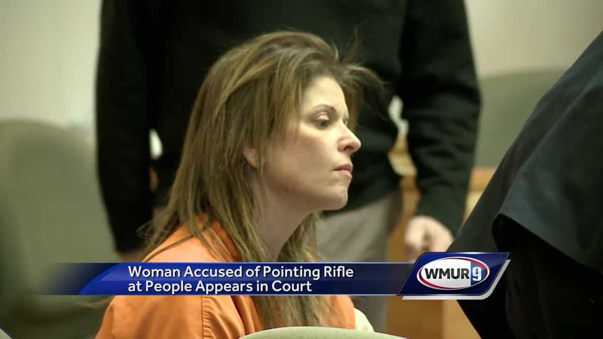 Woman accused of pointing rifle at people appears in court